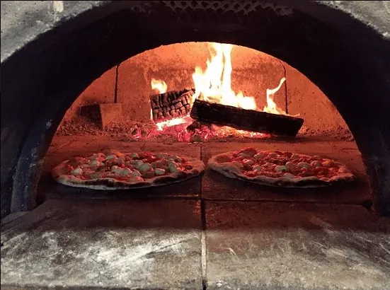 Pizzas in the wood oven at Justino's Wood Oven Pizza, Oakville