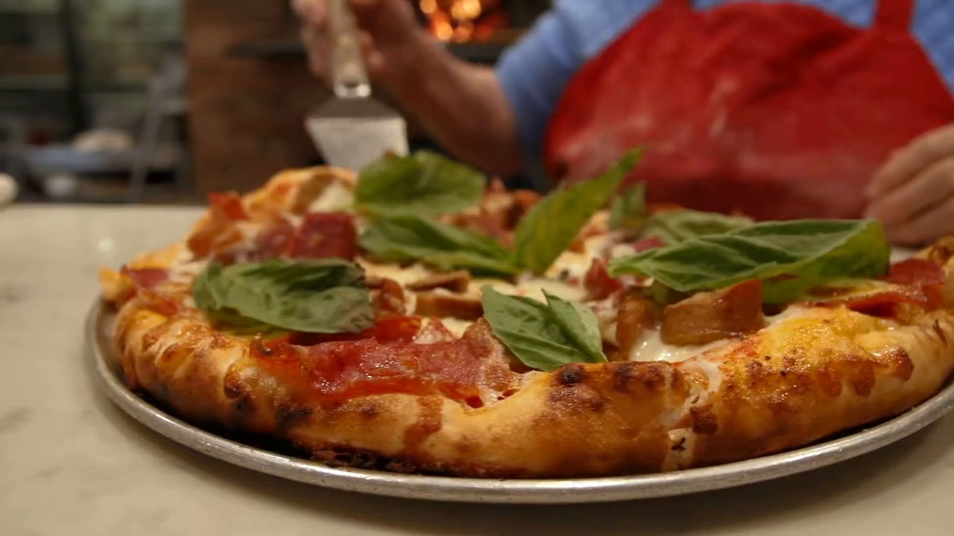 Margherita pizza fresh from Justino's wood oven
